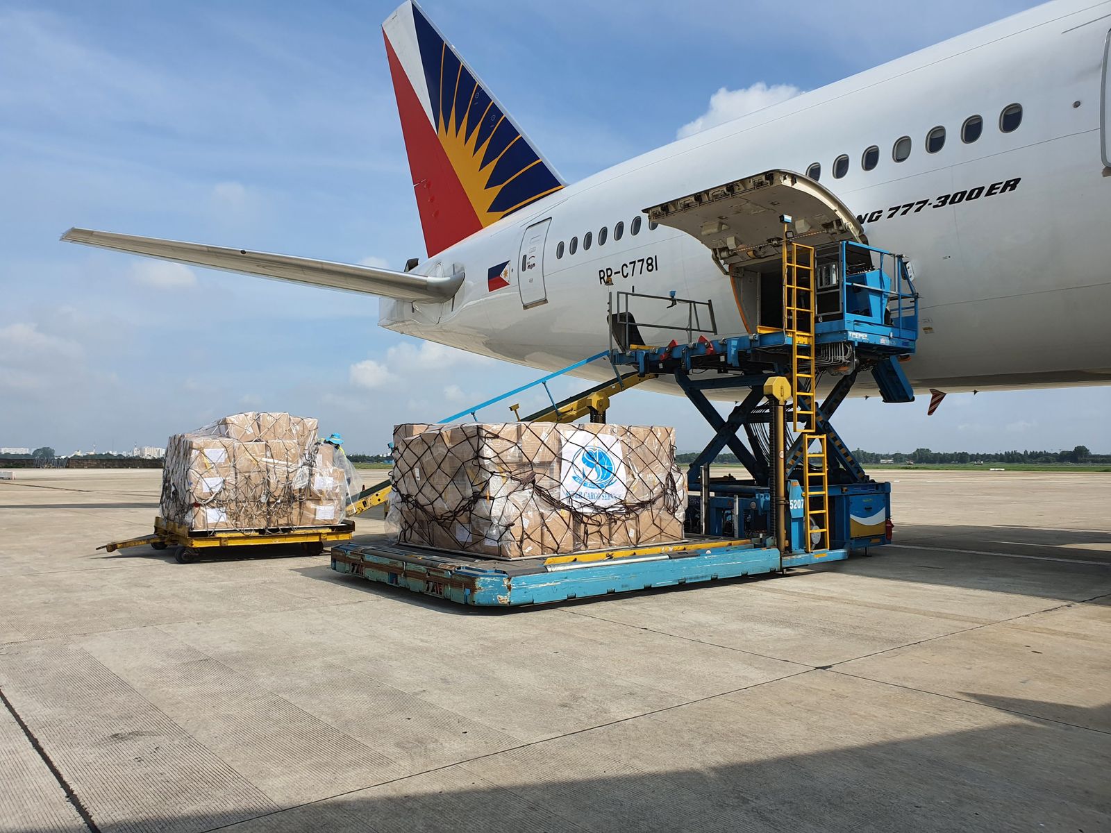Cargo pallets being loaded onto an aircraft